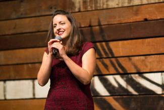 A woman holding a microphone