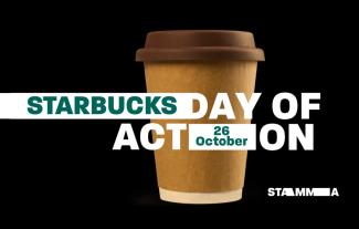 A cup from a coffee shop with the words 'Starbucks Day of Action' surrounding it