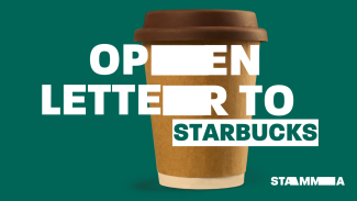 A takeaway coffee cup with 'Our open letter to Starbucks' over it