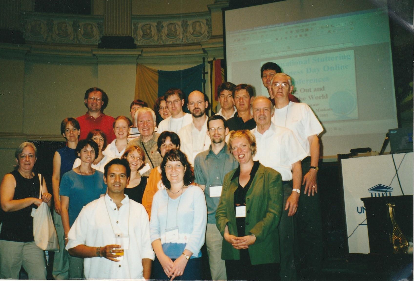 A group of meeting looking at the camera