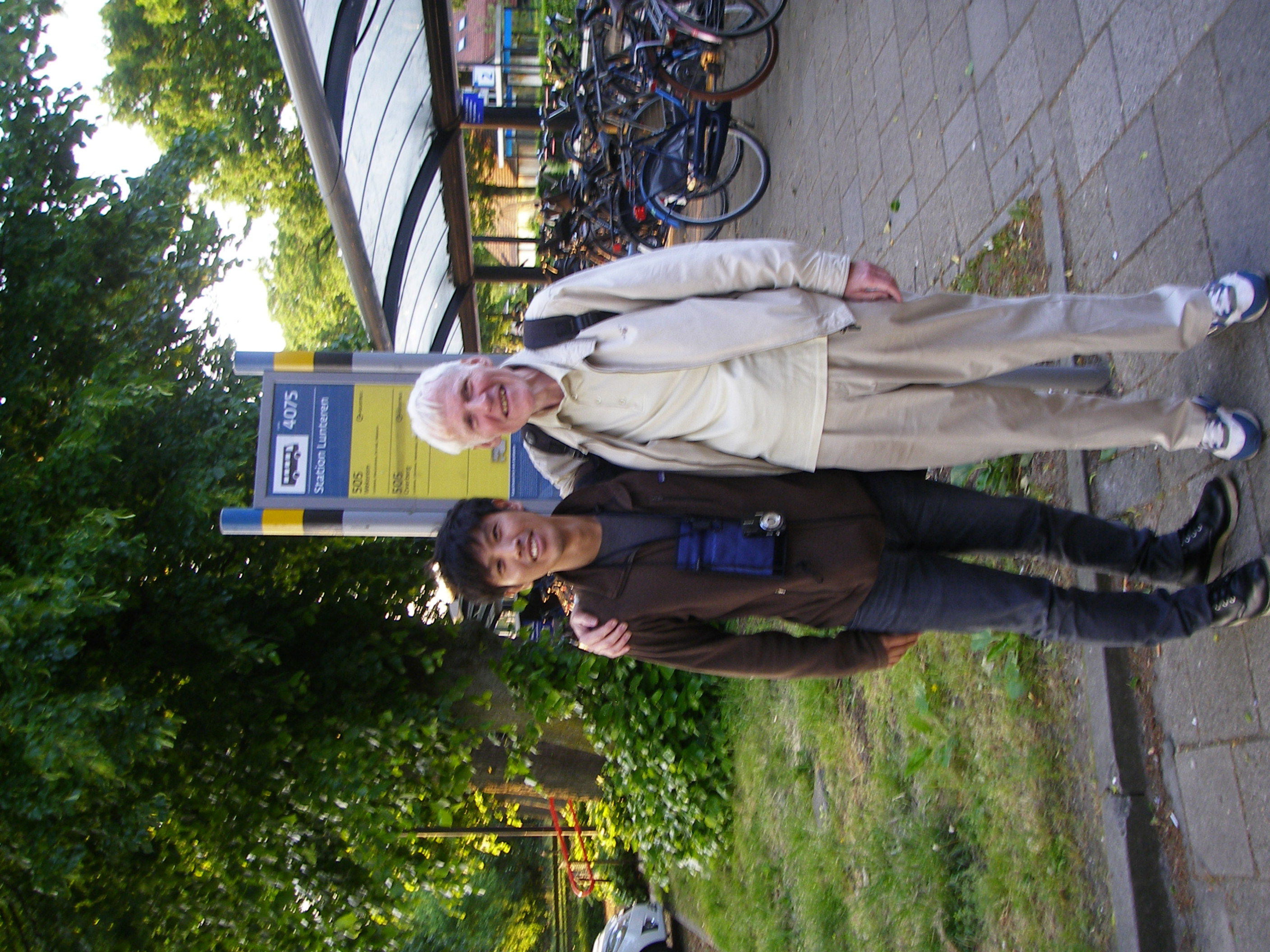 Two men smiling and looking at the camera