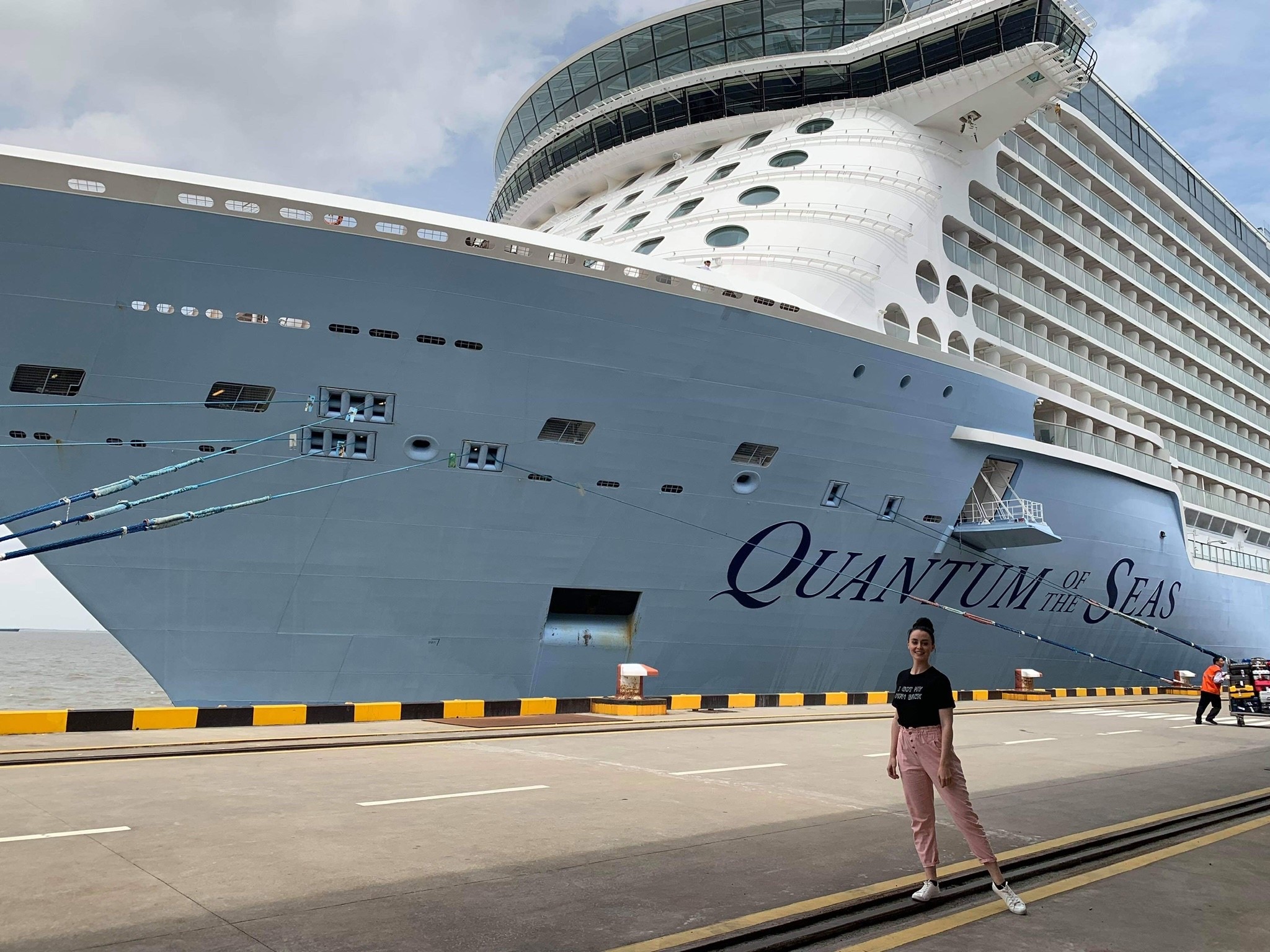 Allie beside a cruise ship