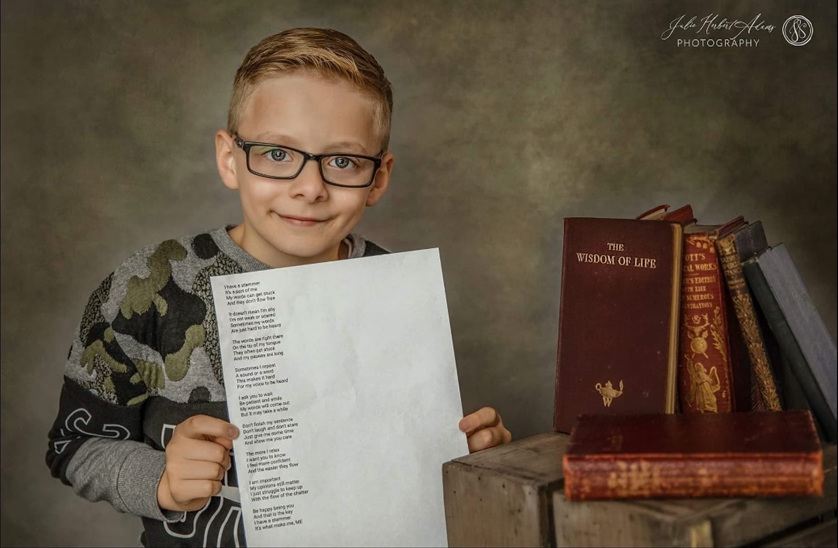 Sam holding a copy of his poem